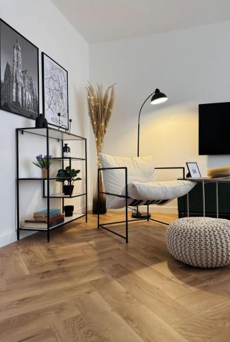 Televízia a/alebo spoločenská miestnosť v ubytovaní Apartment YuPa