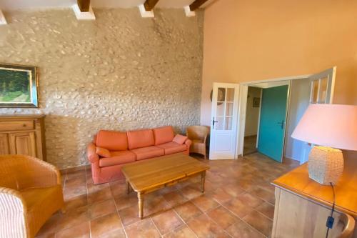 a living room with a couch and a table at 04B8 Beautiful T3 in the heart of lavender - pool in Brunet