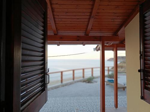 a door to a house with a view of the ocean at Gavdos Panorama in Gavdos