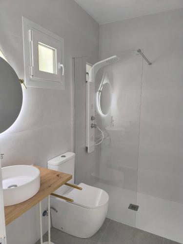 a bathroom with a toilet and a sink and a shower at BUNGALOW 26 in Cala d´Or