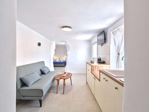 a living room with a couch and a table at Lefkes Blissful Home in Lefkes