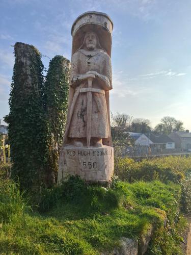 a statue of a bust of a person on a field at Kates Place Studio 1 in Donegal