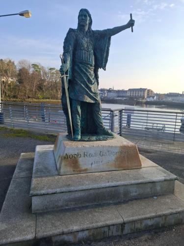 a statue of a man holding a spear at Kates Place Studio 1 in Donegal