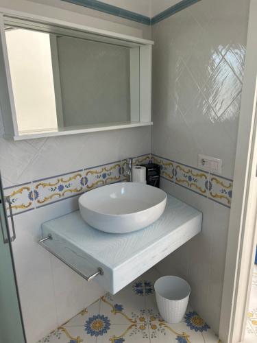 a bathroom with a sink and a mirror at Casa Nannina in Anacapri
