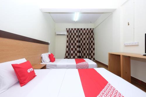 Ένα ή περισσότερα κρεβάτια σε δωμάτιο στο Hotel O 75