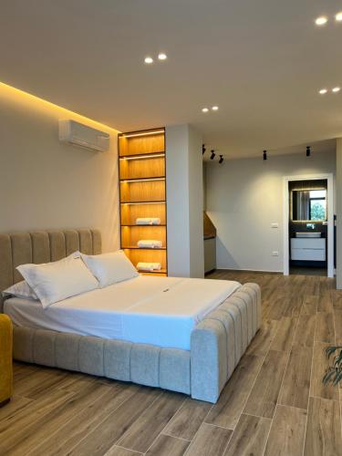 a bedroom with a large bed in a room at Villa Xika in Sarandë