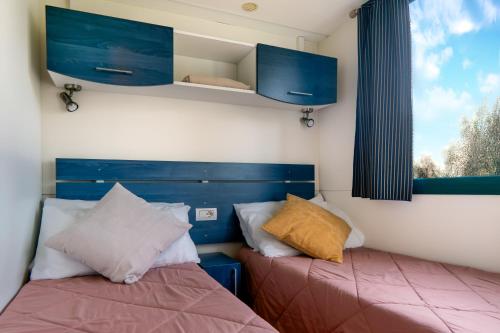 Letto o letti in una camera di Sereno Camping Holiday