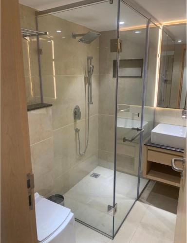 a bathroom with a shower and a toilet at Hotel Pavilion in Mussoorie