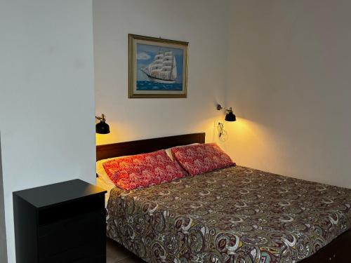 Postel nebo postele na pokoji v ubytování Mezzano B&B
