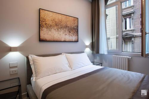 Cavour Suite Apartmentsにあるベッド
