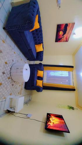 a room with a bunk bed and a computer on a desk at PureBliss Homes in Mombasa