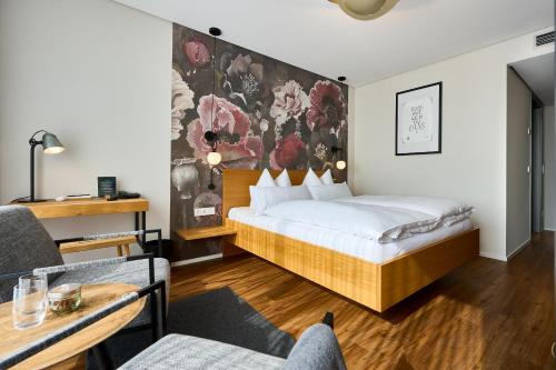 Postel nebo postele na pokoji v ubytování WeinHotel Fritz Walter