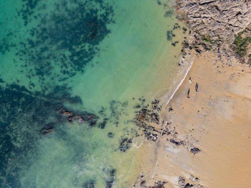 an overhead view of a beach and the ocean at Hôtel Le Nautilus in Saint Malo