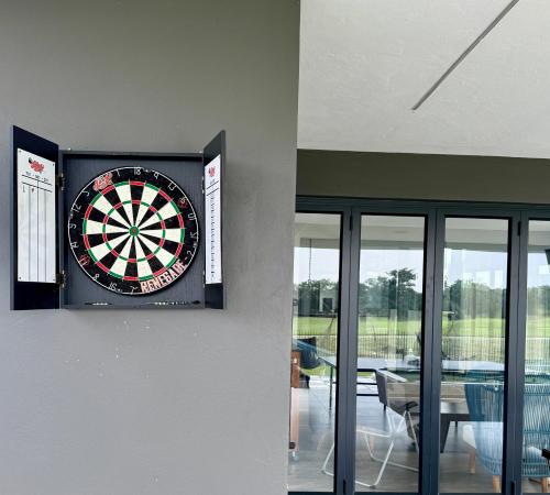 a dart board on the wall of a house at The Views at 492 Euphoria Golf Estate in Naboomspruit
