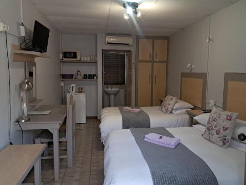 Katil atau katil-katil dalam bilik di Hopetown Guesthouse