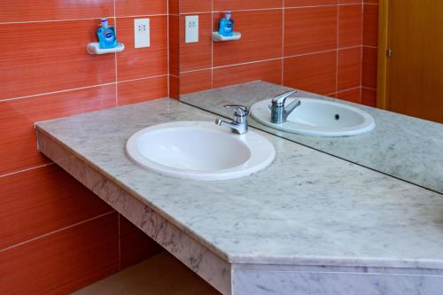 a bathroom counter with two sinks in a room at Pentridge 3-Bed Haven in Lagos