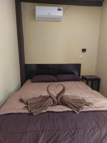 Ένα ή περισσότερα κρεβάτια σε δωμάτιο στο RD Hotel Resto and Familly Karoke