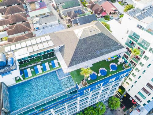 an overhead view of a building with a swimming pool at Sira Grande Hotel, Patong in Patong Beach