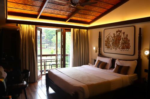 Postel nebo postele na pokoji v ubytování Hotel Kodai International