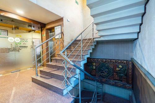 a staircase in a building with a stair case at Treebo Kings Orchid in Bengaluru