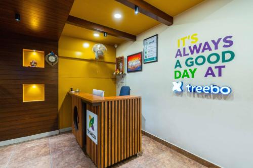 an office with a sign on the wall at Treebo Kings Orchid in Bengaluru