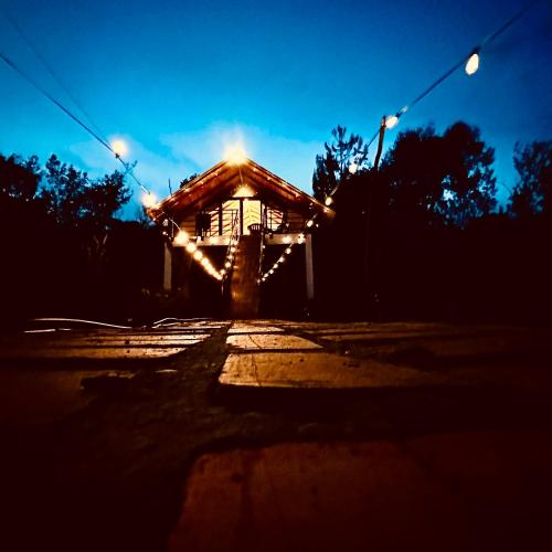 a lit up building with lights in the dark at Toscana Romántica in Guatavita