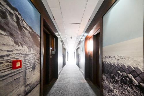 a hallway in an office building with a hallway sidx sidx at Hotel Selene Pomezia in Pomezia