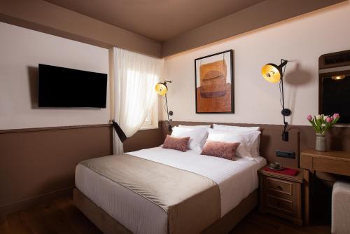 Una cama o camas en una habitación de The K Nest Hotel Nafplio