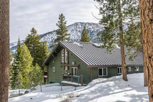a green house in the woods in the snow at Cedar and Snow in Mammoth Lakes