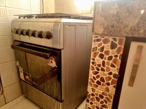 an old stove in a kitchen with a giraffe at Sunny side up in Kyambogo