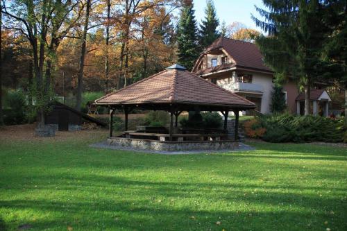 a gazebo in the yard of a house at Chata Guľka Kováčová in Kováčová