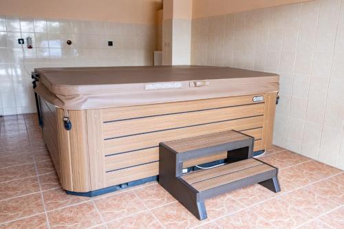 a wooden counter in a bathroom with a sink at Chata Guľka Kováčová in Kováčová