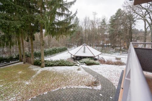 a view of a garden with a gazebo at Chata Guľka Kováčová in Kováčová