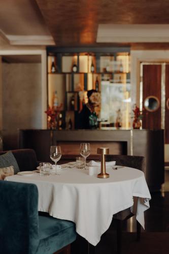 a table with a white table cloth and wine glasses at Sirayane Boutique Hotel & Spa Marrakech in Marrakesh