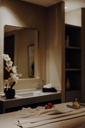 a bathroom with a sink and a mirror at Sirayane Boutique Hotel & Spa Marrakech in Marrakesh