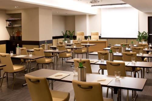 an empty dining room with tables and chairs at Starhotels Metropole in Rome