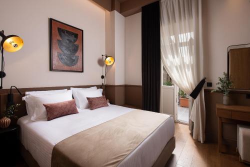 Una cama o camas en una habitación de The K Nest Hotel Nafplio