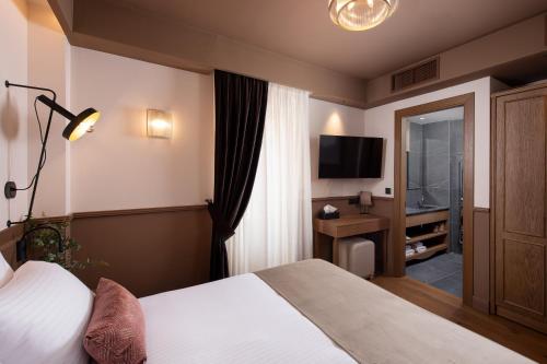 Una cama o camas en una habitación de The K Nest Hotel Nafplio
