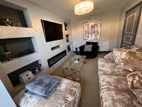 a living room with a couch and a tv at Luxury Durham Home in DH1, Free Parking, No Fees in Durham