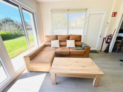 a living room with a couch and a coffee table at La Moraleja de Sita in Solares