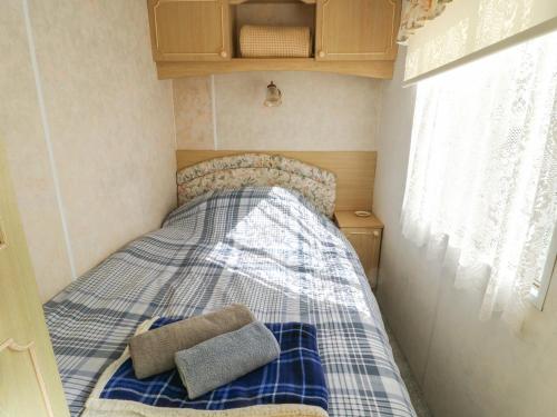 Ένα ή περισσότερα κρεβάτια σε δωμάτιο στο Fron Dderw Caravan