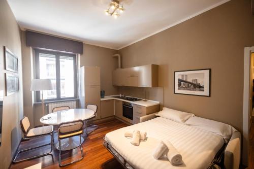 Una cama o camas en una habitación de Darsena Navigli Luxury Living