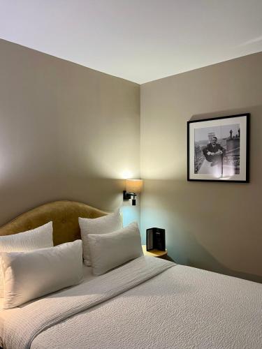 Un ou plusieurs lits dans un hébergement de l'établissement Hôtel Central Saint Germain