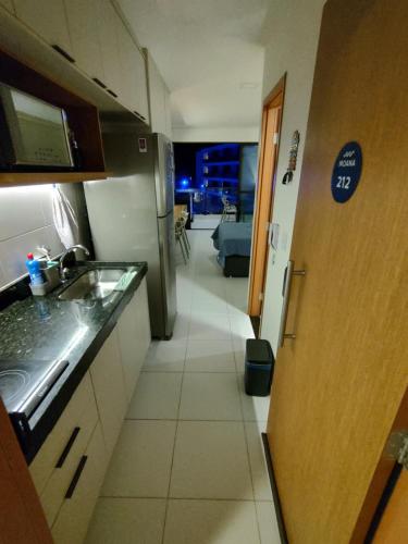 a kitchen with a sink and a counter top at Malia Beach Muro Alto 300 Metros Do Mar in Porto De Galinhas