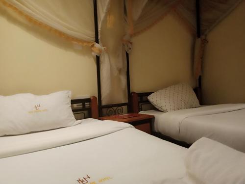 Postel nebo postele na pokoji v ubytování Urbane Hotel Urbane Plaza