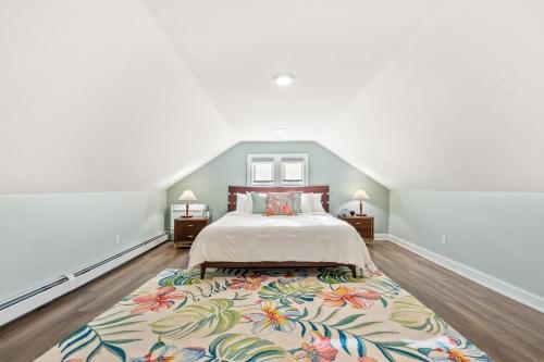 a bedroom with a bed and a large rug at Federal Hill PRIDE in Providence