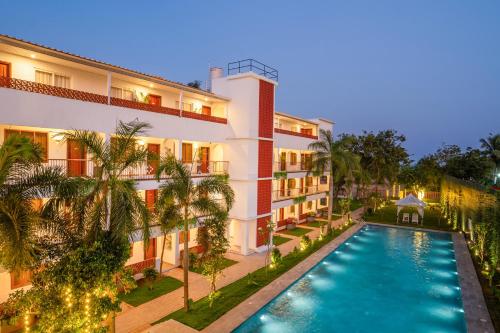 an aerial view of a hotel with a swimming pool at Madras Chronicle Bay Resort & Spa in Mahabalipuram