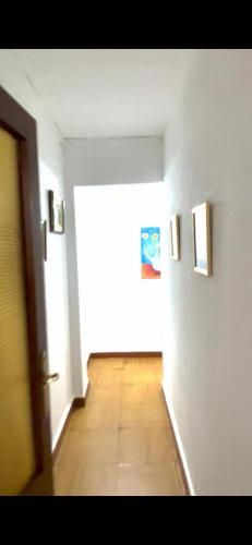 an empty room with a hallway with a wooden floor at Apartament 3 Bedrooms 80m2 Alto Campoo Reinosa Cantabria in Reinosa