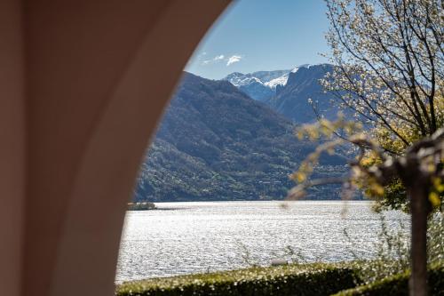 a view of a lake with mountains in the background at Villa Principessa - Private Villa with Panoramic Lake Como Views in Cremia
