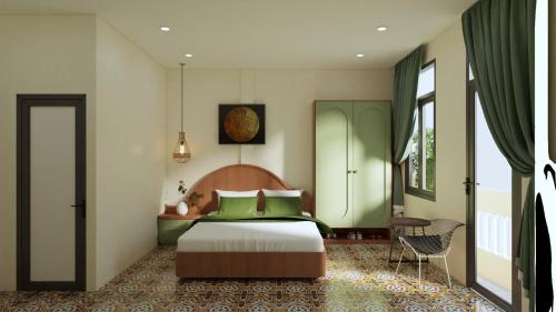 a bedroom with a bed with green pillows at SKY Homestay in Hue